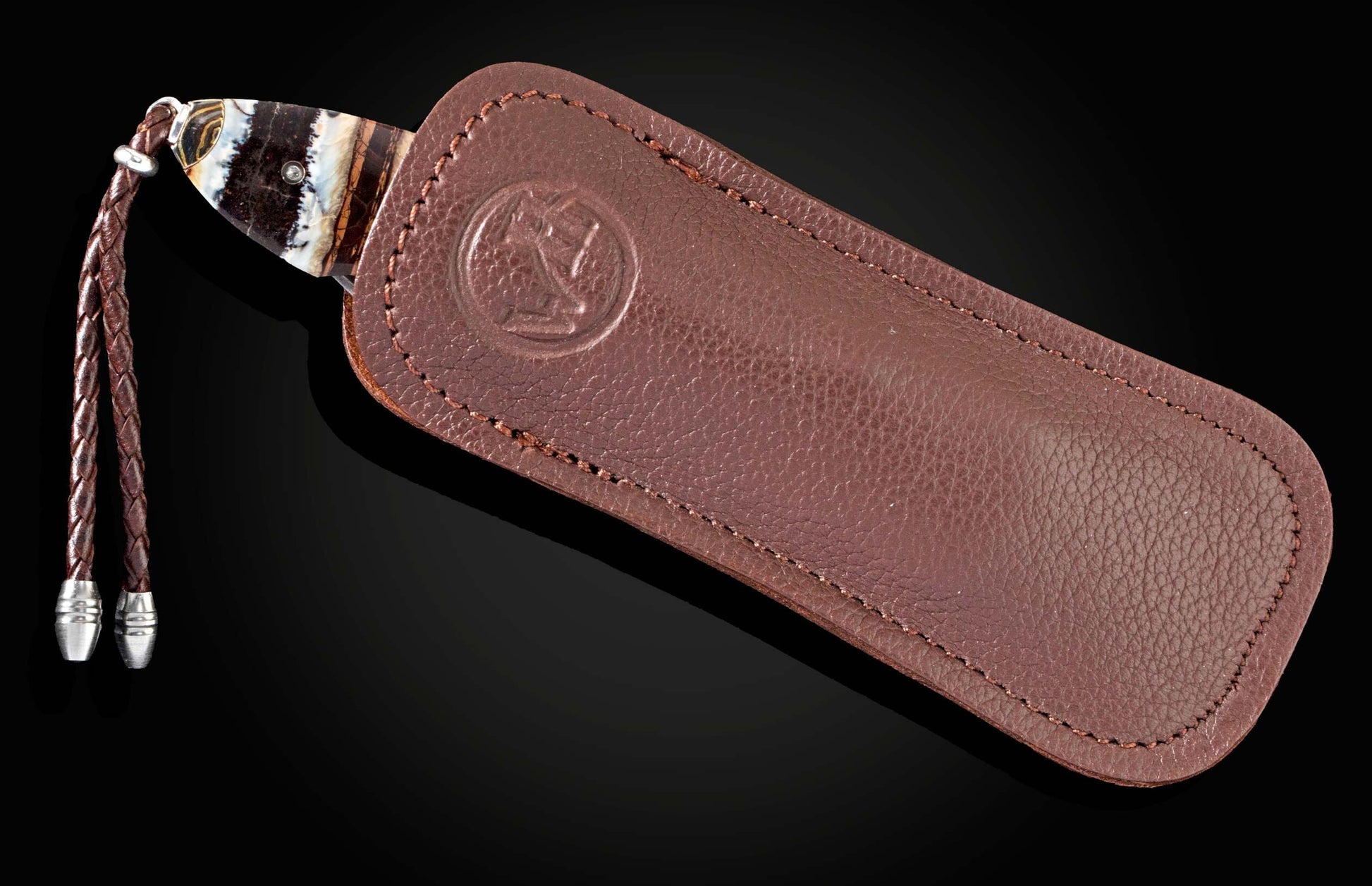  and a hand-forged Damascus steel blade by Chad Nichols.