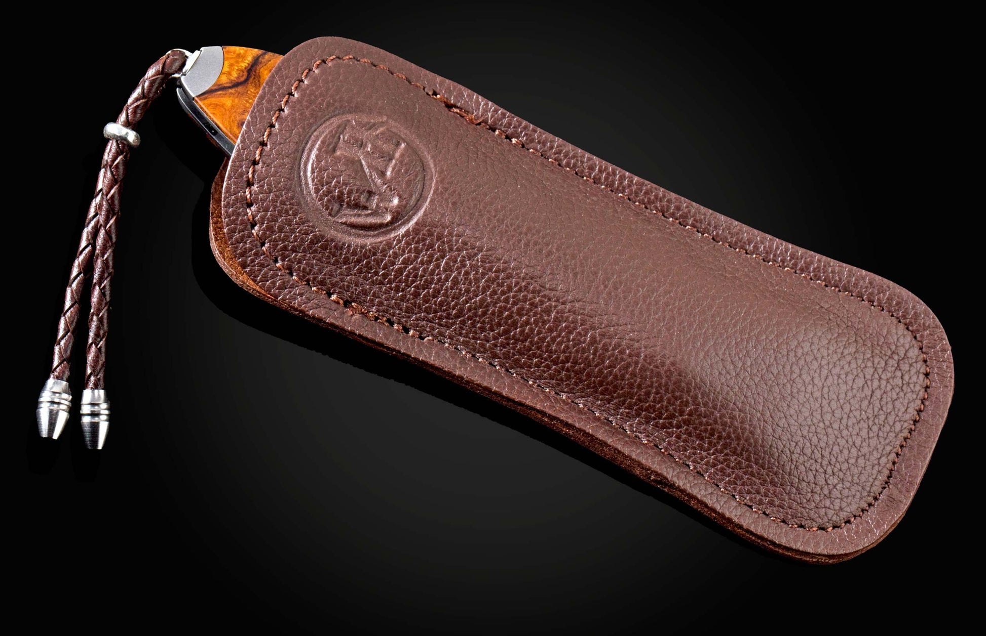  and a hand-forged Damascus steel blade by Chad Nichols