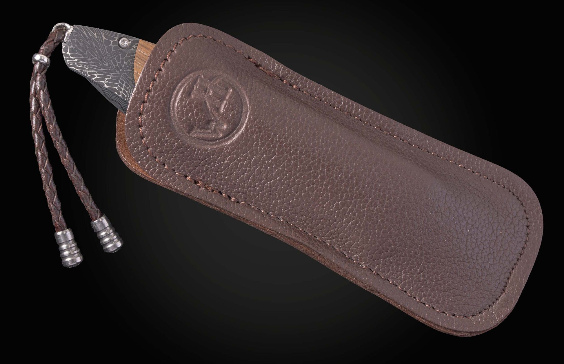 Custom William Henry knife with bolsters in hand-forged damascus by Chad Nichols