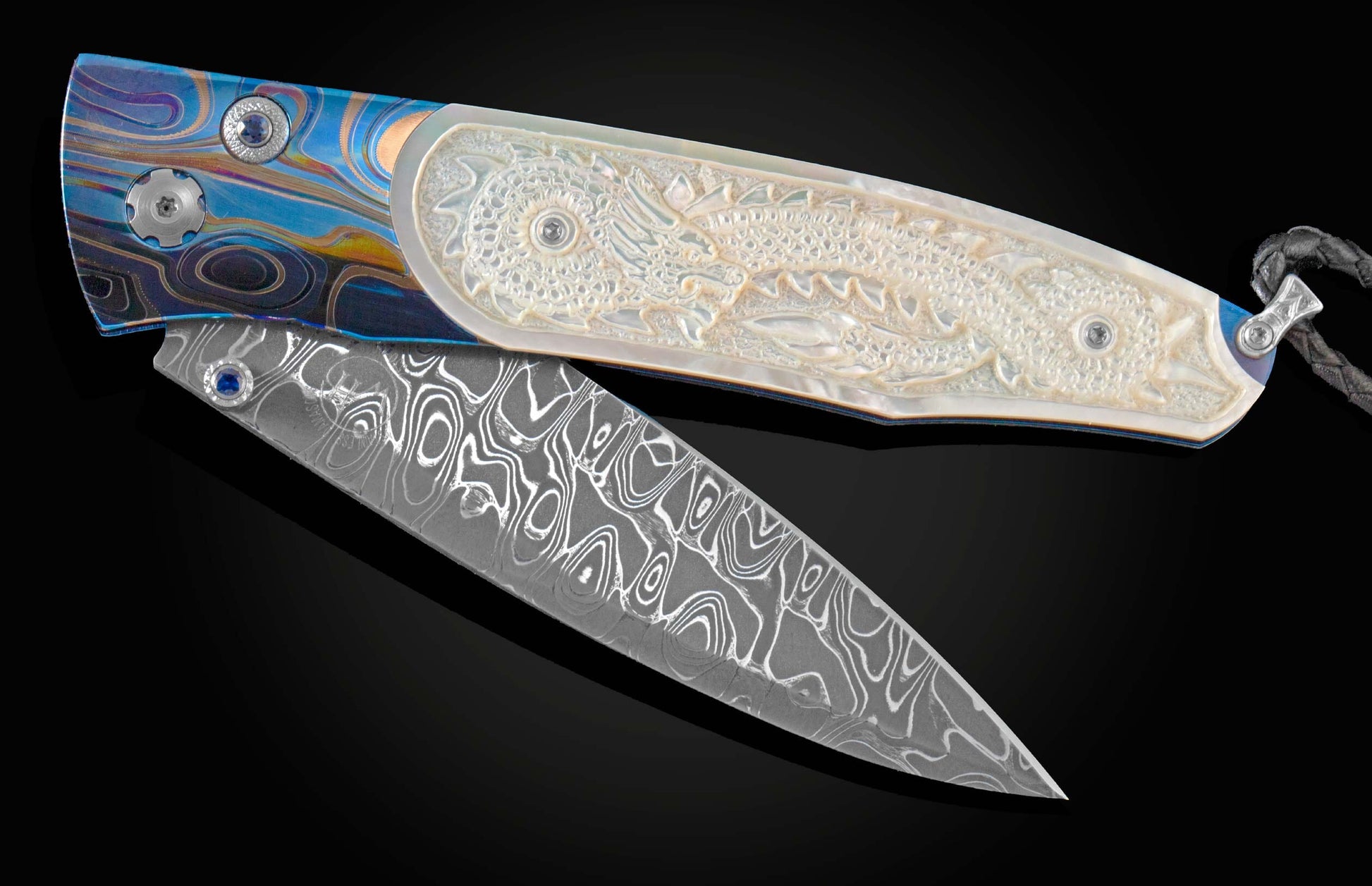 Handcrafted William Henry pocket knife with blue titanium frame, inlaid with hand-carved pearl by Lee Downey, blue sapphire gemstones, and a hand-forged damascus steel blade by Luke Mattern
