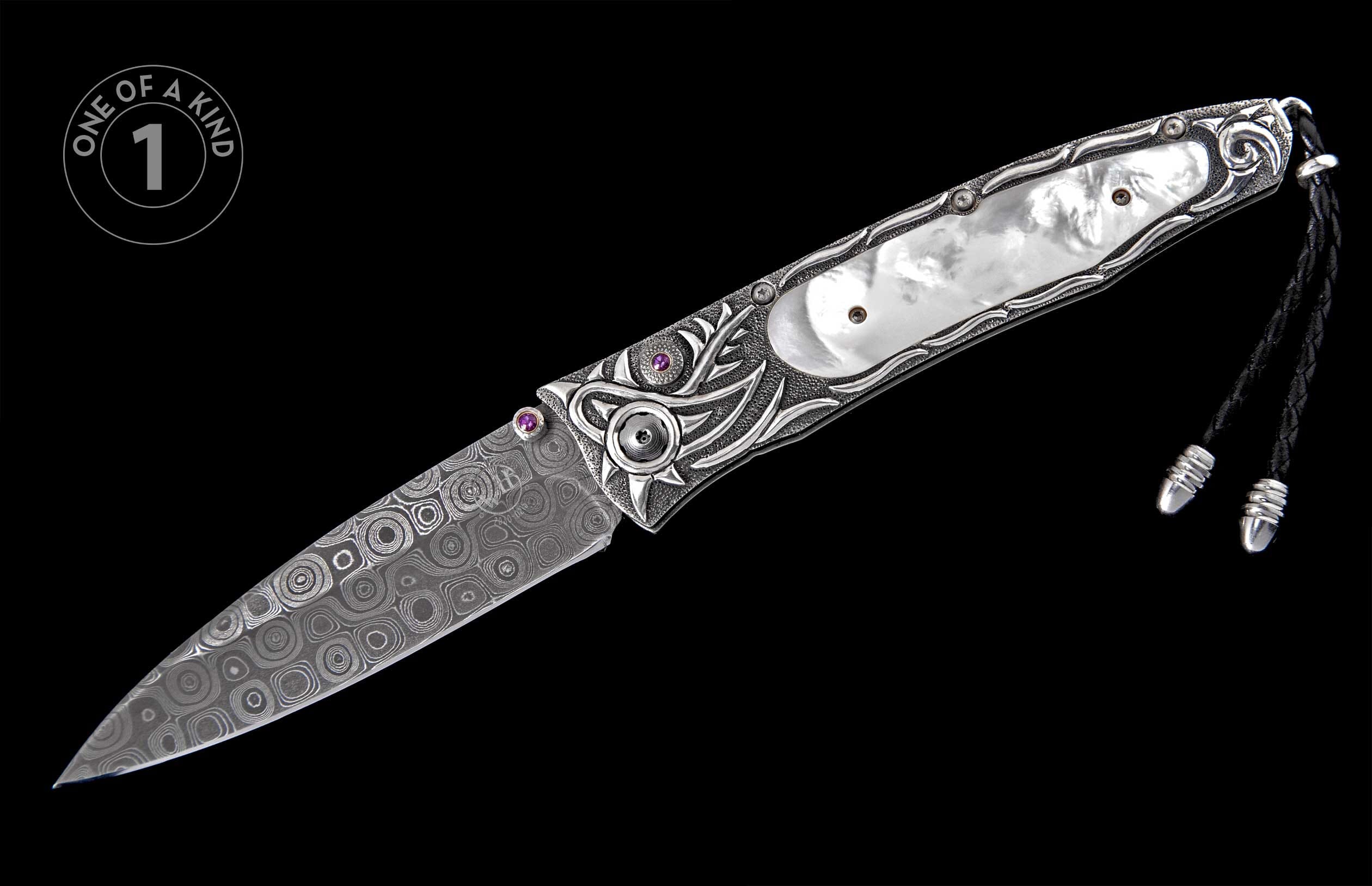 Ornate folding knife with a patterned Damascus steel blade, silver-toned handle featuring mother-of-pearl, purple gemstones, and a black leather lanyard.