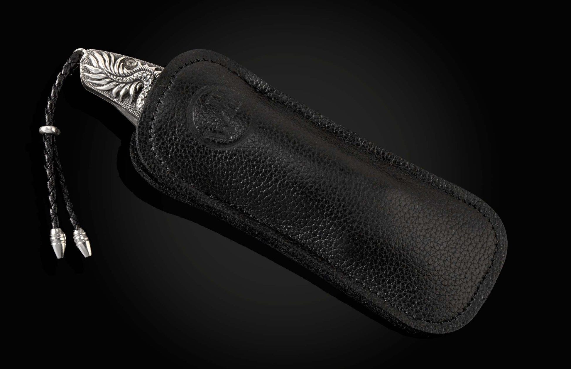 The GenTac Sterling Silver Dragon Pocket Knife in a leather case