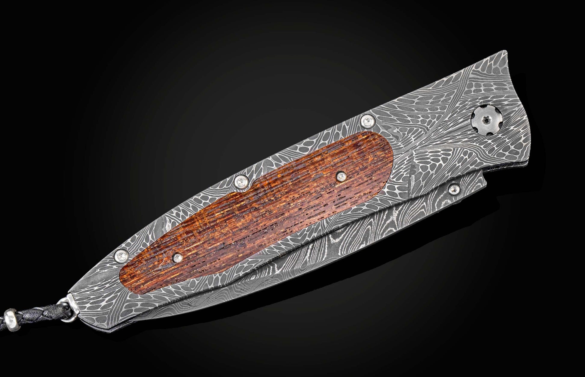  and a hand-forged Damascus steel blade by Chad Nichols