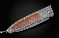  and a hand-forged Damascus steel blade by Chad Nichols