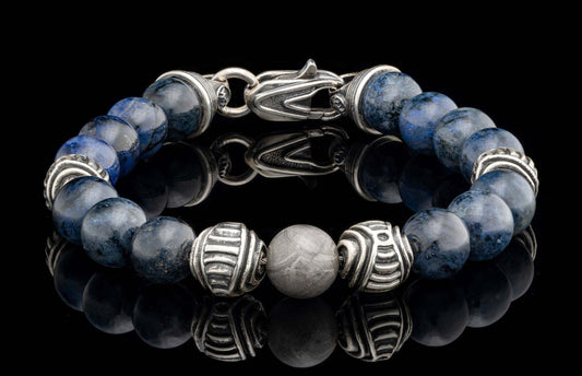 Dark blue beaded bracelet with textured silver beads, a grey patterned metallic bead, and a silver clasp.