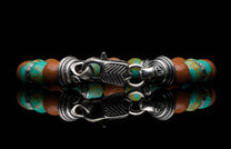  sterling silver accents and a custom clasp.