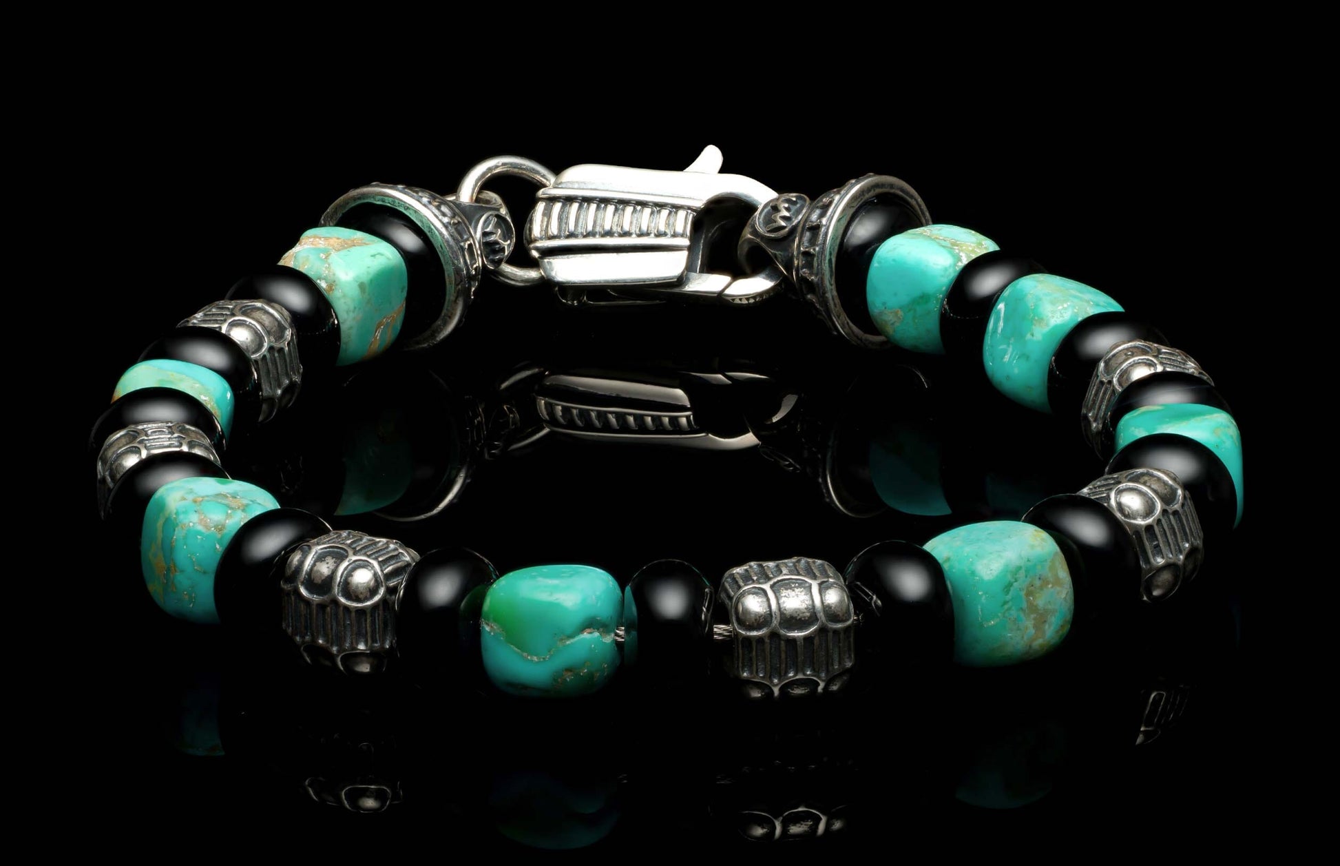 Handcrafted William Henry men's bracelet with Kingman turquoise cube beads, polished black onyx rondelles, and sculpted sterling silver quilted cube beads, finished with a custom clasp