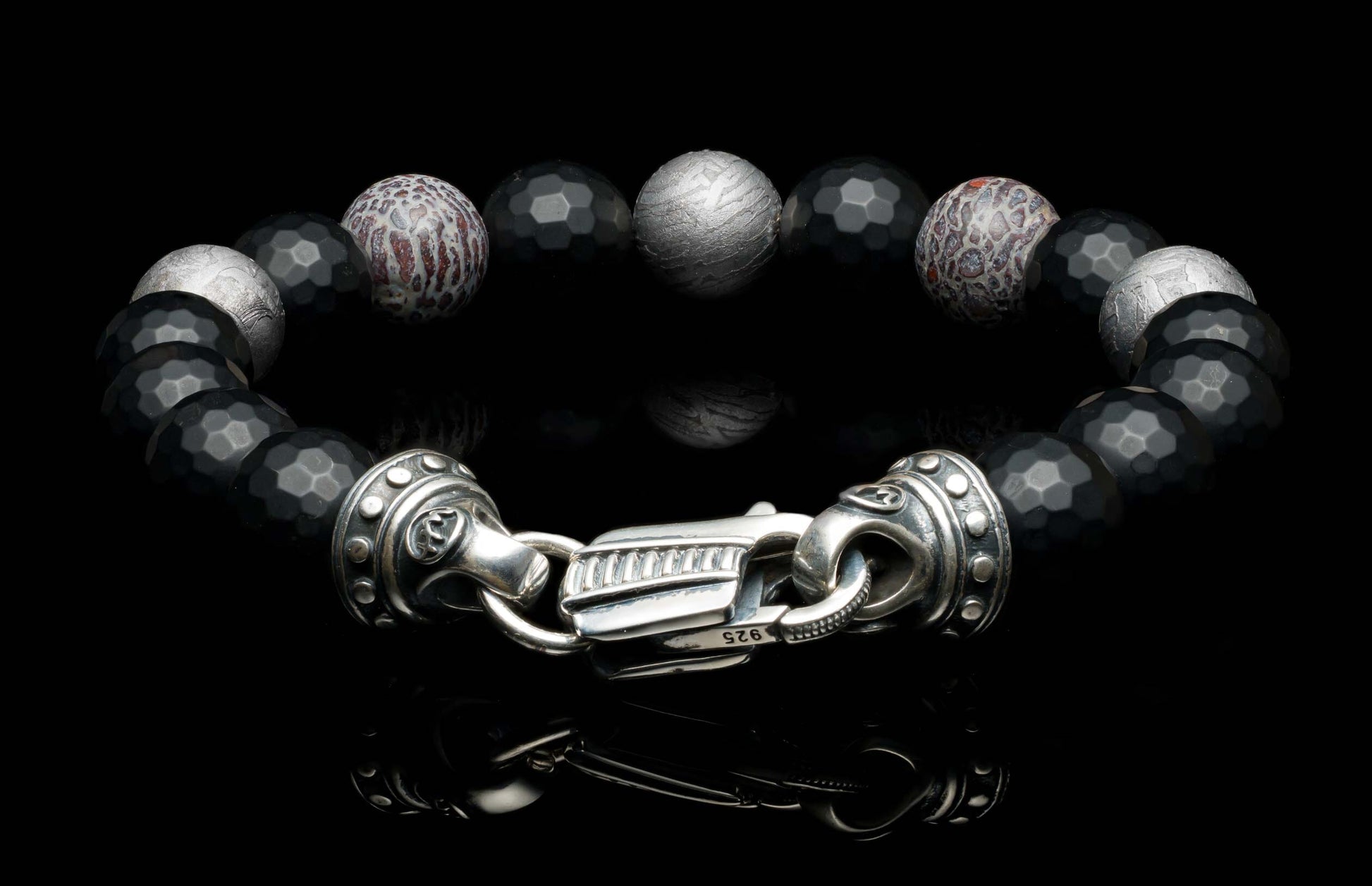 Handcrafted William Henry men's bracelet blends dinosaur bone and Gibeon meteorite beads with matte faceted black onyx and a custom clasp