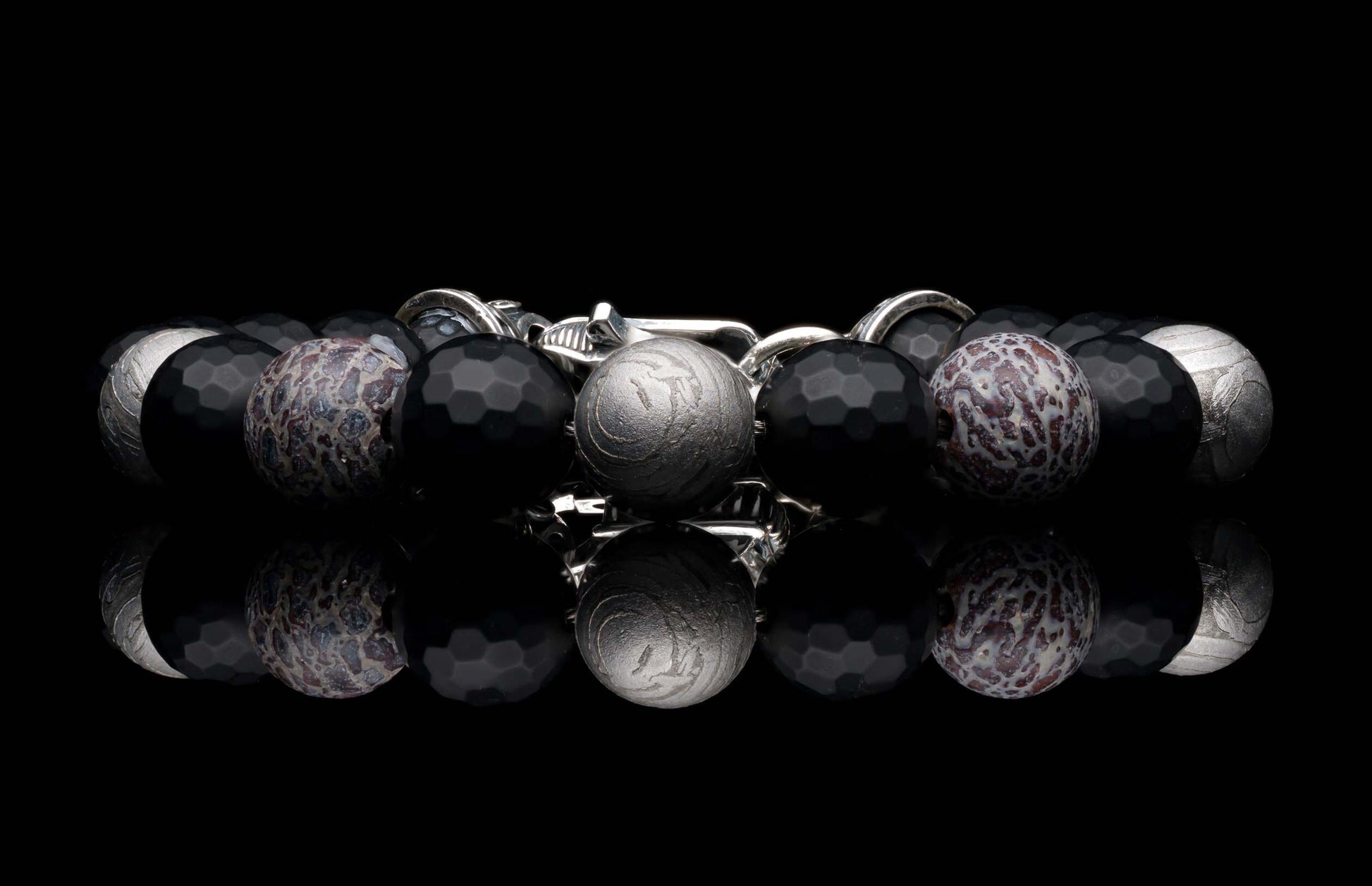Handcrafted William Henry men's bracelet blends dinosaur bone and Gibeon meteorite beads with matte faceted black onyx and a custom clasp