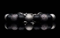 Handcrafted William Henry men's bracelet blends dinosaur bone and Gibeon meteorite beads with matte faceted black onyx and a custom clasp