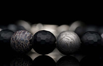Handcrafted William Henry men's bracelet blends dinosaur bone and Gibeon meteorite beads with matte faceted black onyx and a custom clasp