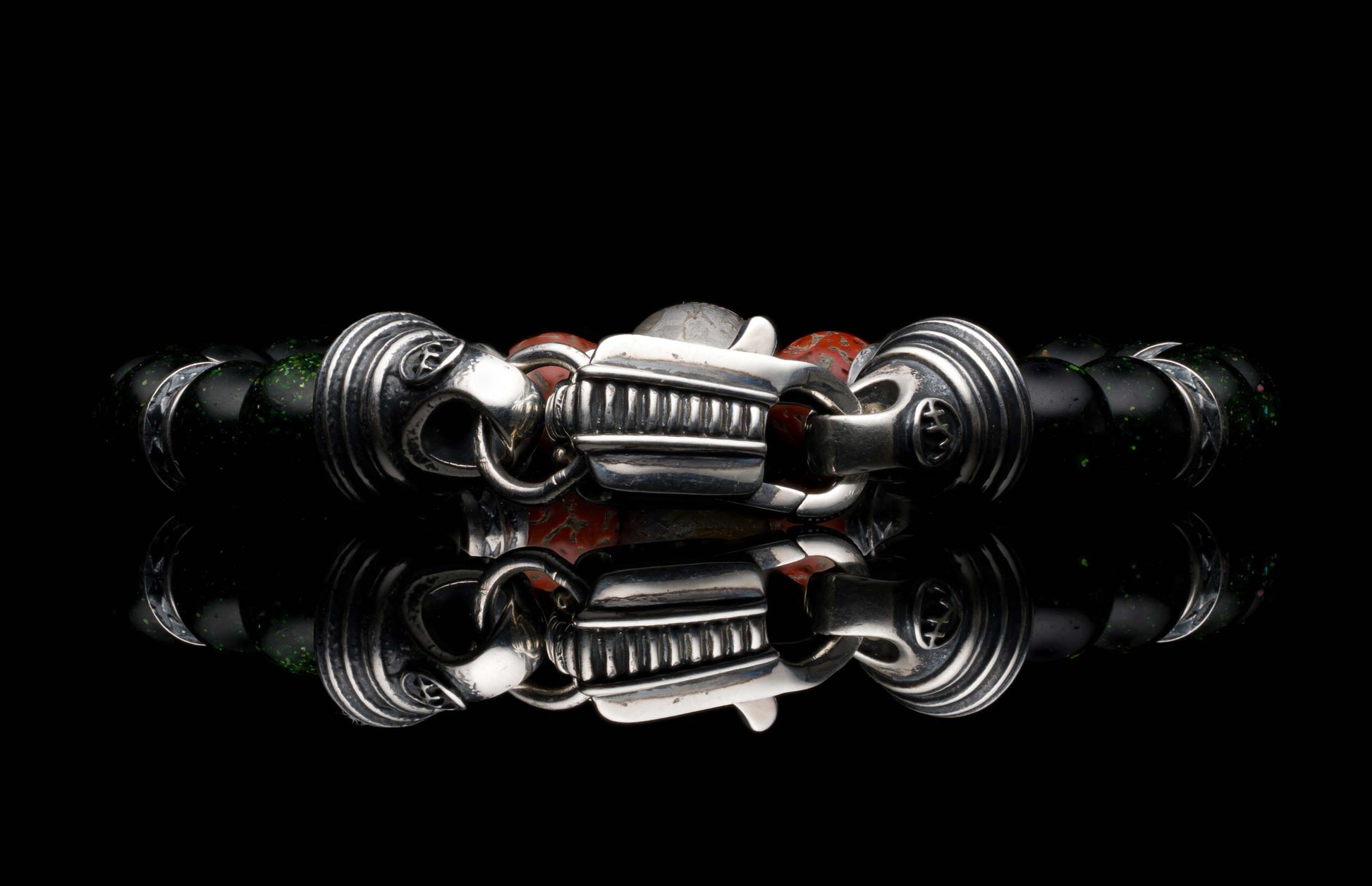 Handcrafted William Henry men's bracelet with dinosaur bone and shimmering green goldstone beads surround a singular Gibeon meteorite bead