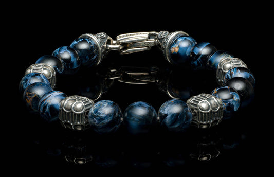 Dark blue marbled beaded bracelet with ornate silver-toned accents and a hook clasp.