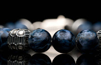  quilted sterling silver cube accents and a custom clasp.