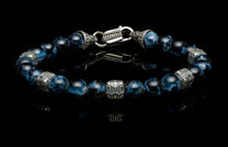 Handcrafted William Henry men's bracelet with Pietersite beads and quilted sterling silver cubes, finished with a custom clasp.