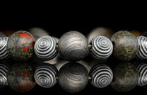 Beaded bracelet with meteorite, dinosaur bone, and Tiger's Eye beads