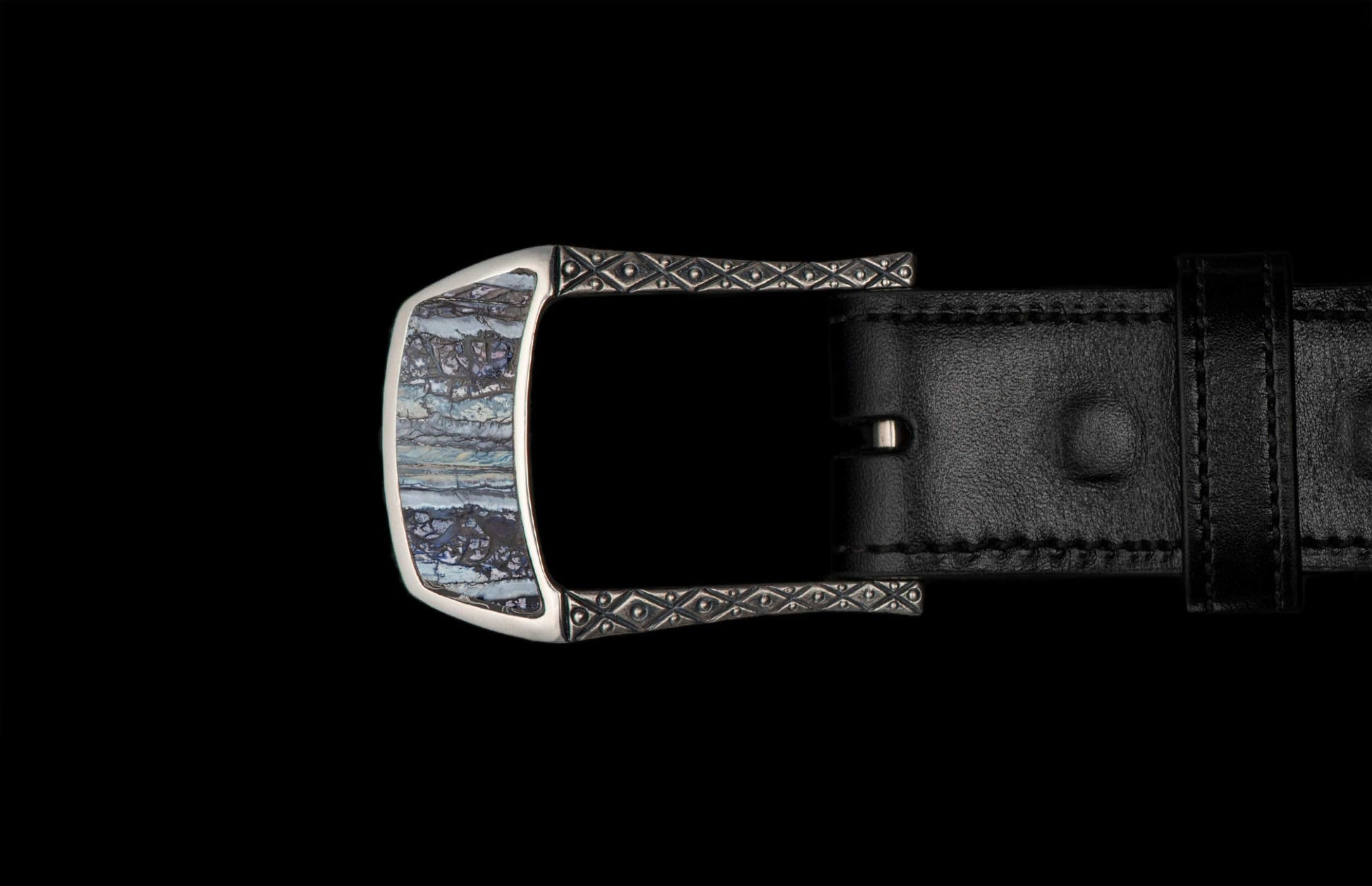 Handcrafted designer belt buckle from William Henry in solid sterling silver inlayed with blue Woolly Mammoth Tooth.  Each inlay is hand-polished from a slice of the molar tooth of the Wooly Mammoth.