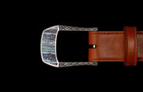 Handcrafted designer belt buckle from William Henry in solid sterling silver inlayed with blue Woolly Mammoth Tooth.  Each inlay is hand-polished from a slice of the molar tooth of the Wooly Mammoth.