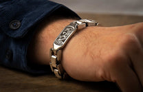 The Damascus Identity Sterling Silver Bracelet with Hand-Forged Damascus on a wrist