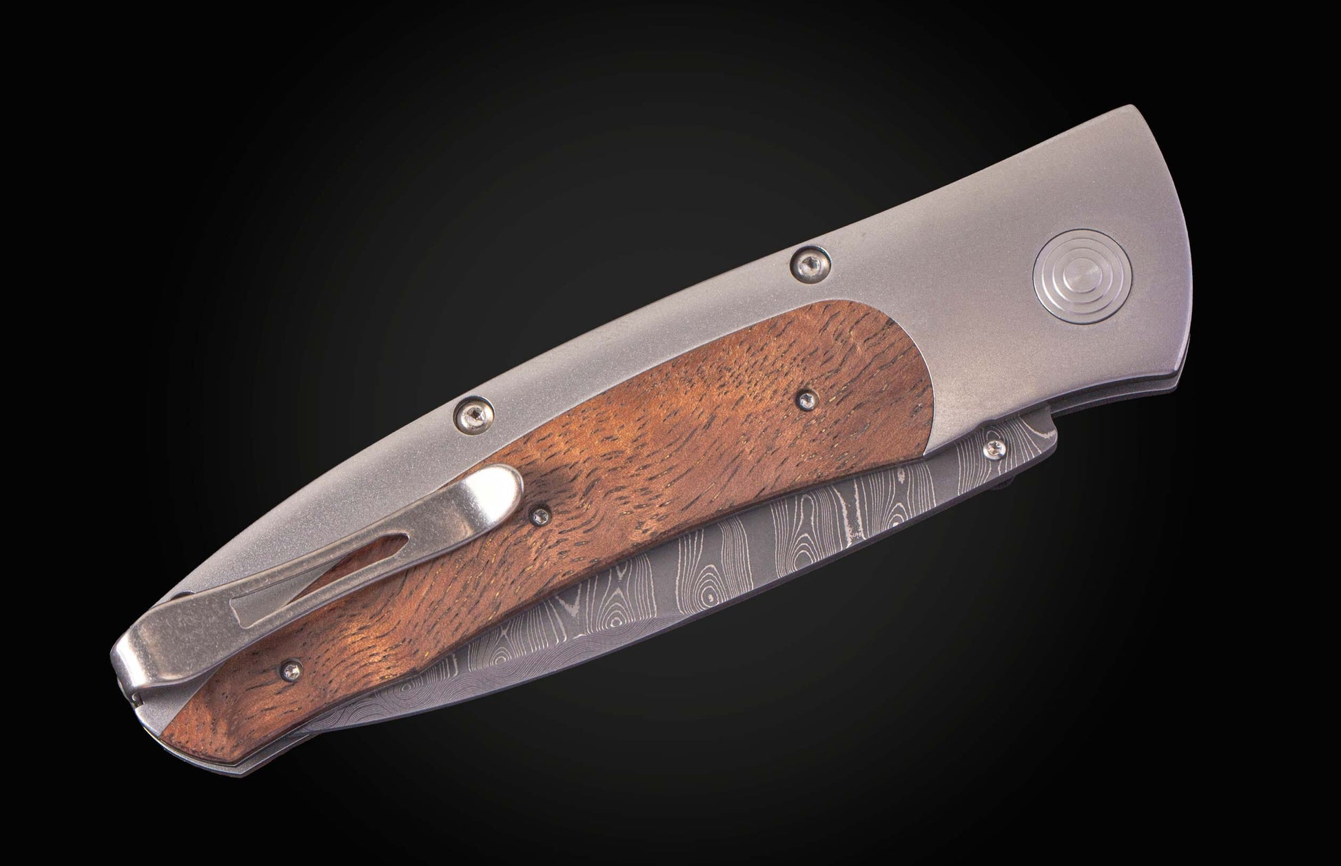  with a hand-forged damascus steel blade by Chad Nichols. 