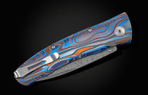 and a hand-forged Damascus steel blade by Chad Nichols