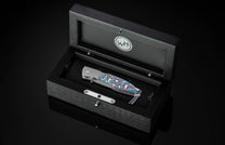  and a is hand-forged 'Intrepid' damascus steel blade by Chad Nichols.