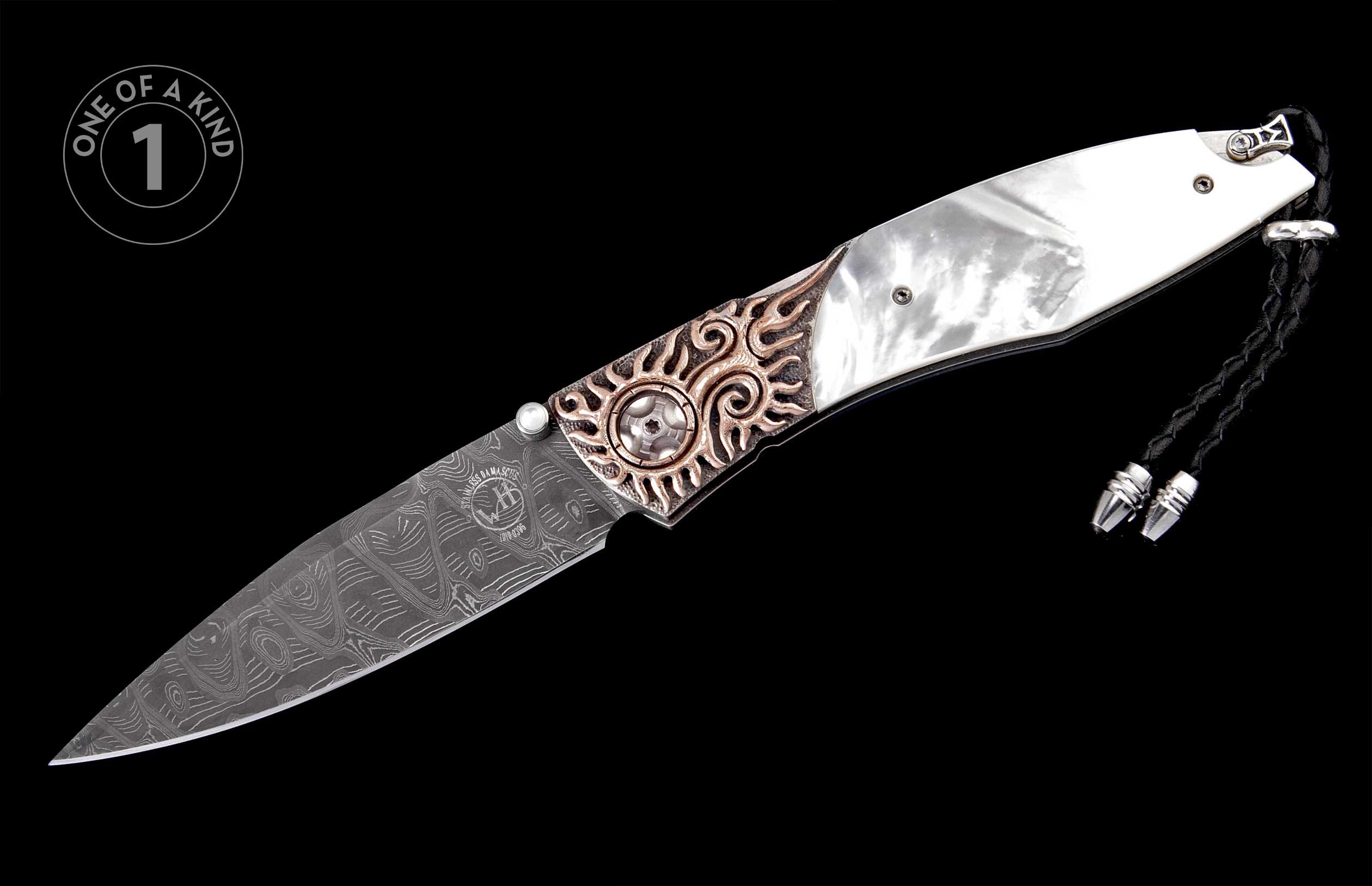 Ornate folding knife with mother-of-pearl scales, Damascus blade, bronze sun-patterned bolster, and a black braided lanyard.