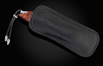 The Redwood Gold Pocket Knife with Redwood Burl Knife Handle in a leather case