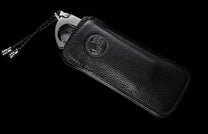The Kingman Customized Cigar Cutter (CG1 KINGMAN) in a leather case