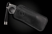 A Carbon Fiber Cigar Cutter in a leather case