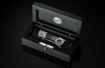 A Carbon Fiber Cigar Cutter in a case