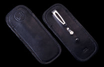 SHEATH 14|Two black leather ClipCase pocket knife sheaths, one with an embossed 'WH' logo, the other a silver clip and 'USA' marking.