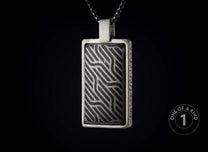 Rectangular silver-toned pendant featuring a black and silver wavy striped pattern, hanging on a matching chain.