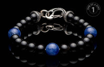 Black onyx and blue sodalite beaded bracelet with a decorative sterling silver clasp.