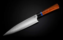 K20-IRM|Silver chef knife by K20 Kultro with a Damascus blade, brown wooden handle, and blue and gold rings, on a reflective black surface.