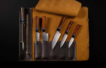 K20-IRM|Chef knives with brown wooden handles and damascus steel blades by K20 Kultro, arranged in a dark brown leather roll with a sharpening rod.