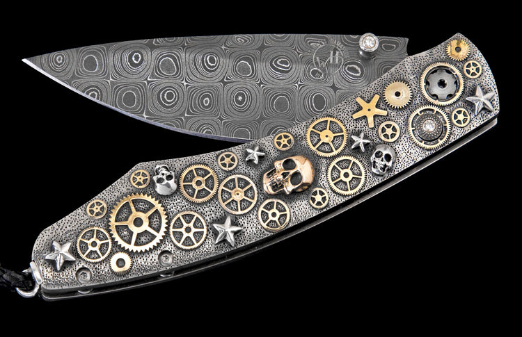 Ornate folding knife with a patterned Damascus steel blade and a textured handle adorned with brass gears, silver stars, skulls, and diamonds.