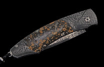 Elegant folding knife featuring dark Damascus steel with organic patterns and a contrasting natural stone handle inlay.