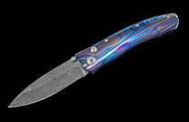 Handcrafted William Henry pocket knife with Laser color-engraved titanium frame and hand forged damascus steel blade