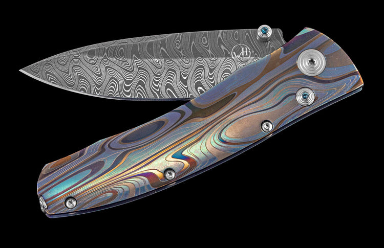 One of a kind William Henry knife with Laser color-engraved titanium frame and hand forged Damascus steel blade