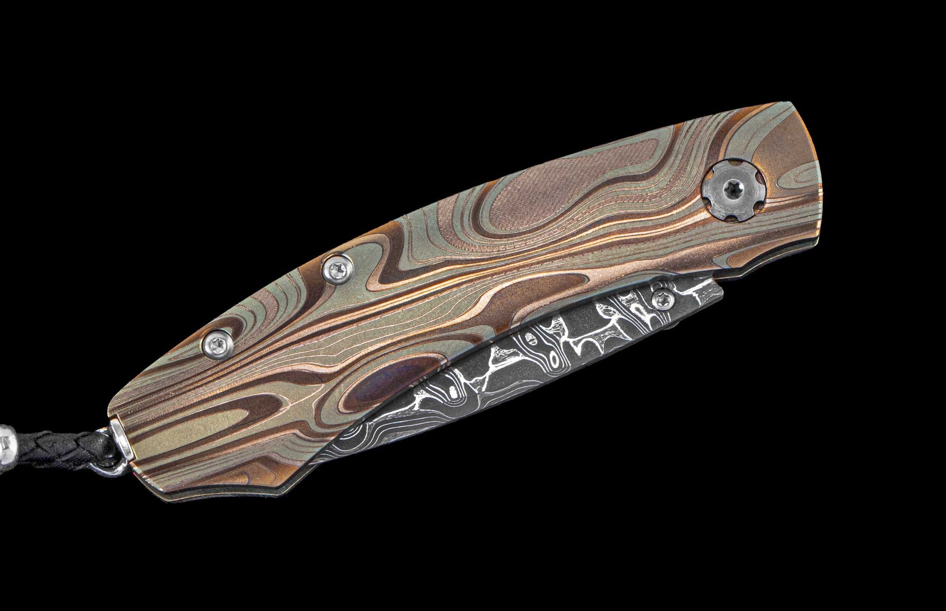 One of a kind William Henry pocket knife featuring a Laser color-engraved titanium frame in swirled colors and a hand forged damascus steel blade