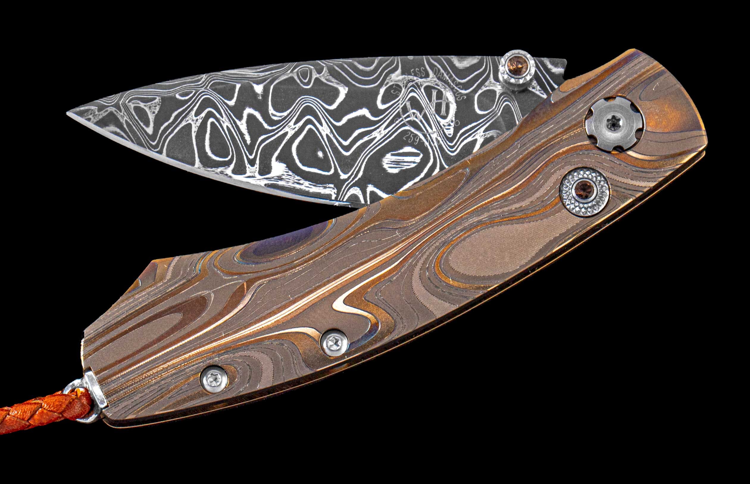 One of a kind custom pocket knife from William Henry featuring a Laser color-engraved titanium frame and hand forged damascus steel blade