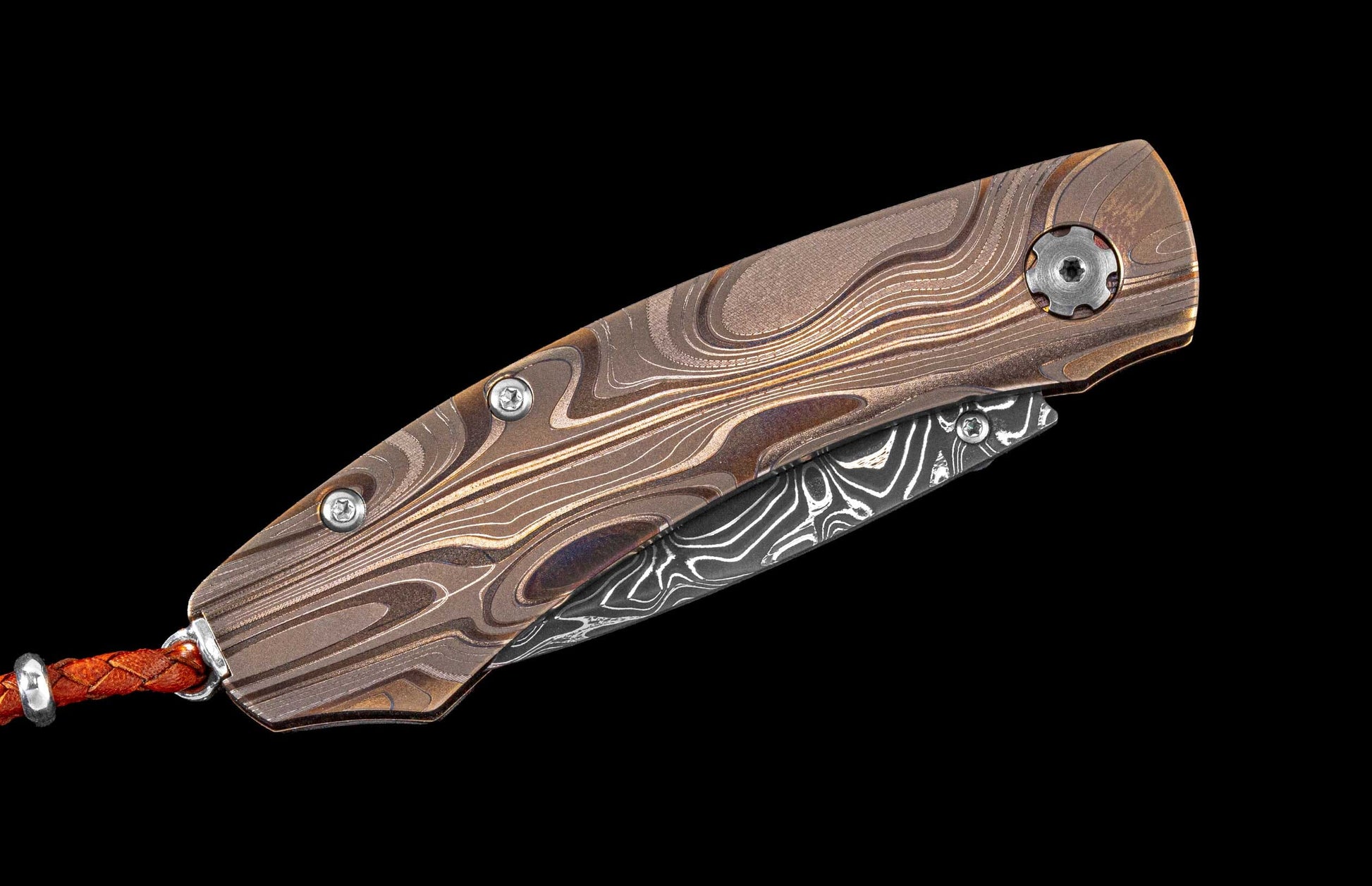 One of a kind custom pocket knife from William Henry featuring a Laser color-engraved titanium frame and hand forged damascus steel blade
