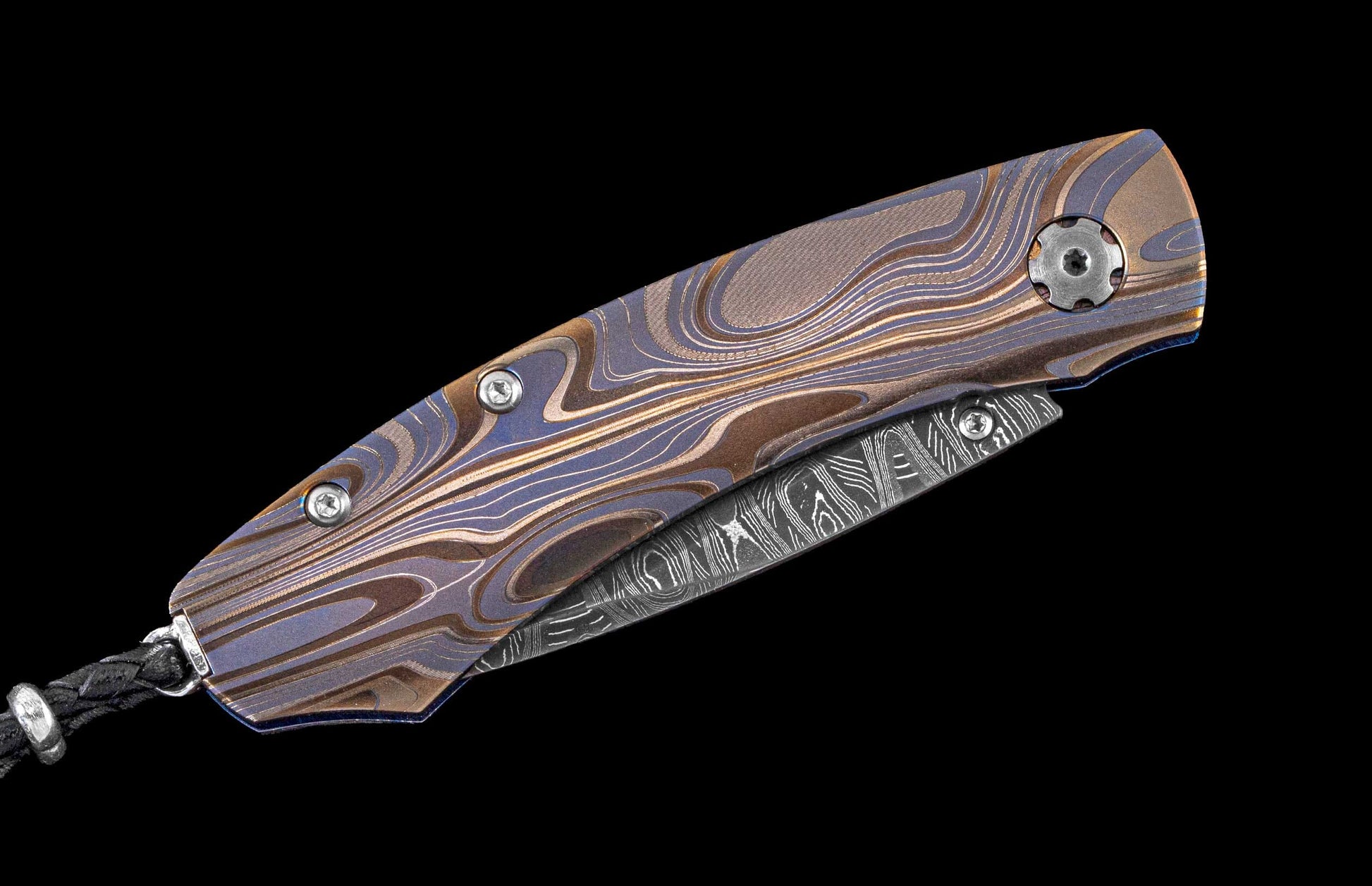 Handcrafted one-of-a-kind William Henry pocket knife featuring a Laser color-engraved titanium frame and hand-forged Damascus steel blade