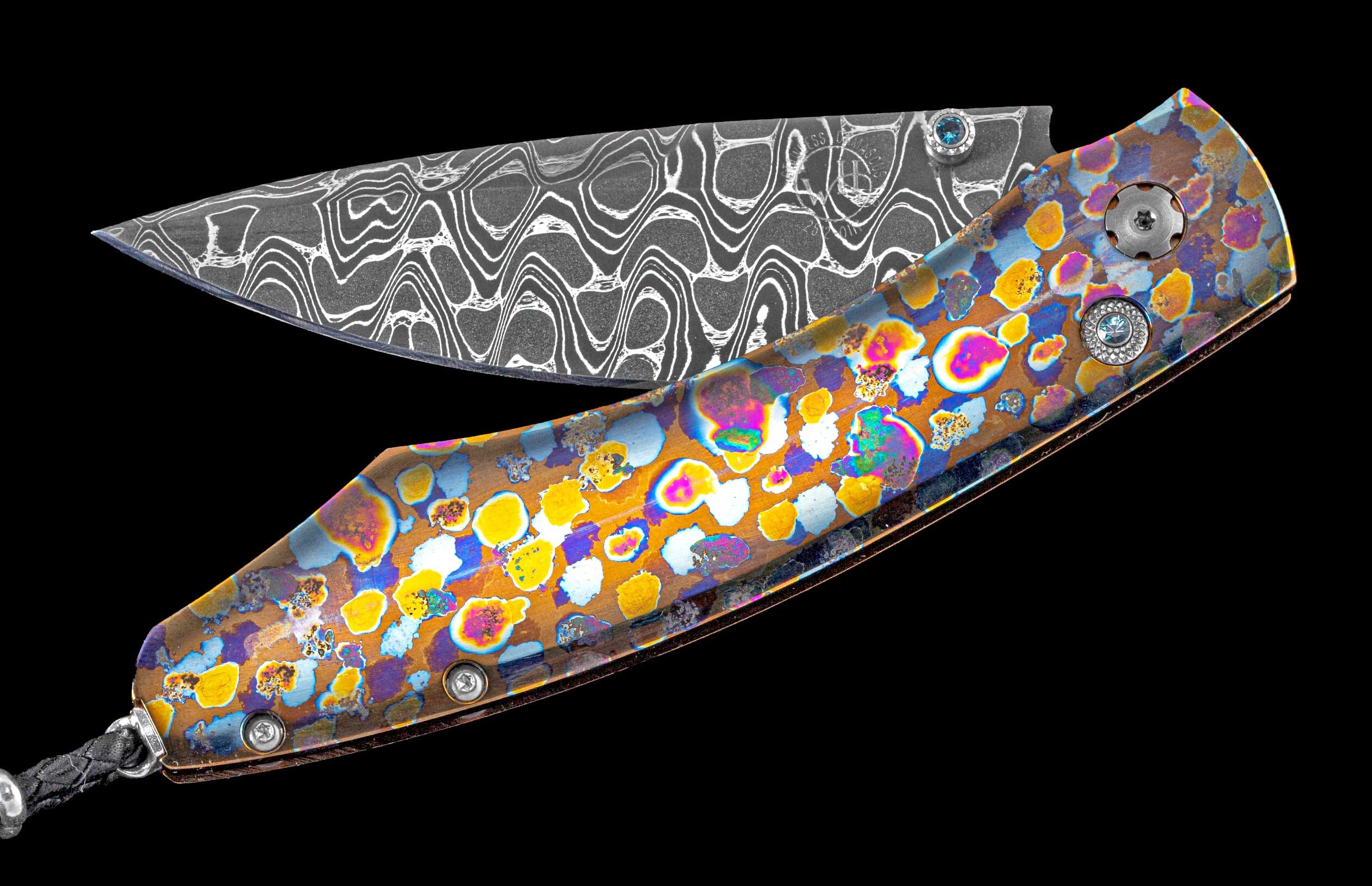 Brightly colored one of a kind William Henry knife featuring a laser colored titanium frame and hand forged damascus steel blade