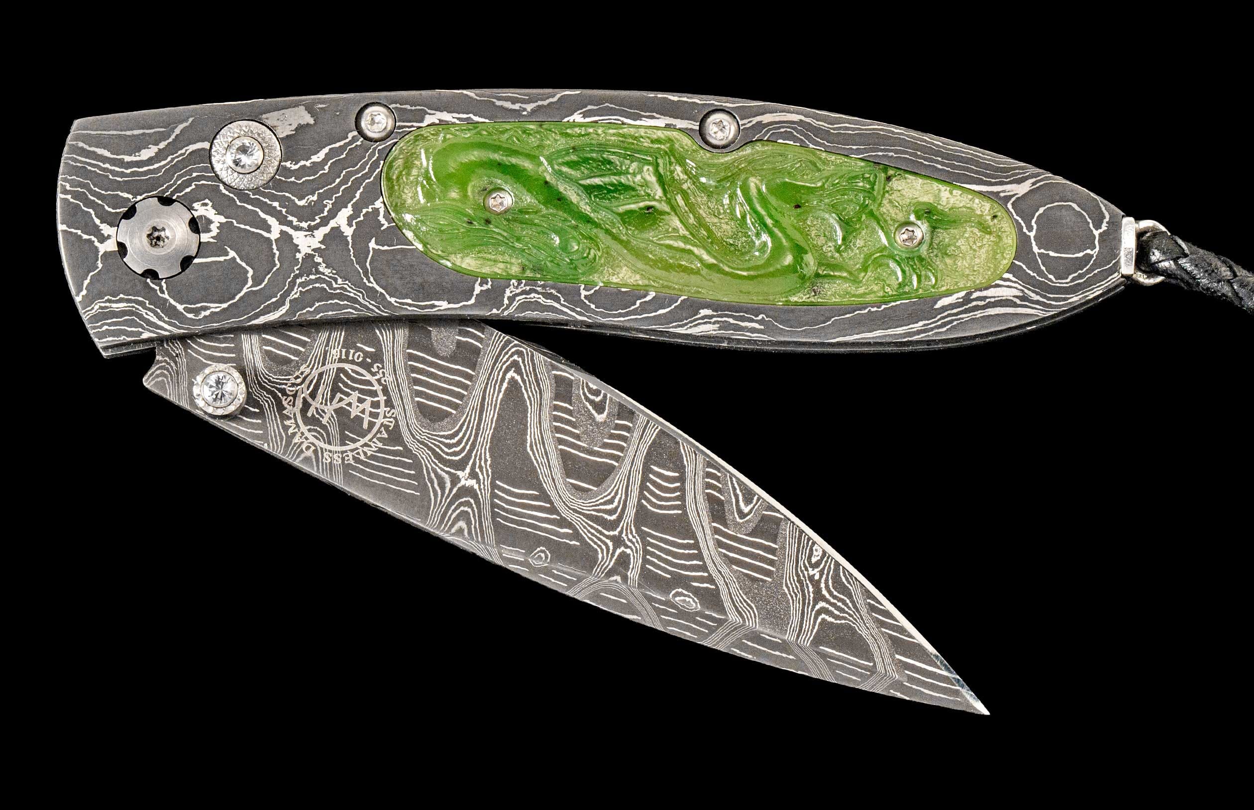 One of a kind custom William Henry Knife with hand-forged Damascus steel, jade, and white topaz. 