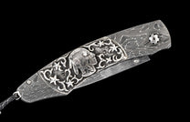 One of a kind custom knife from William Henry with Damascus steel