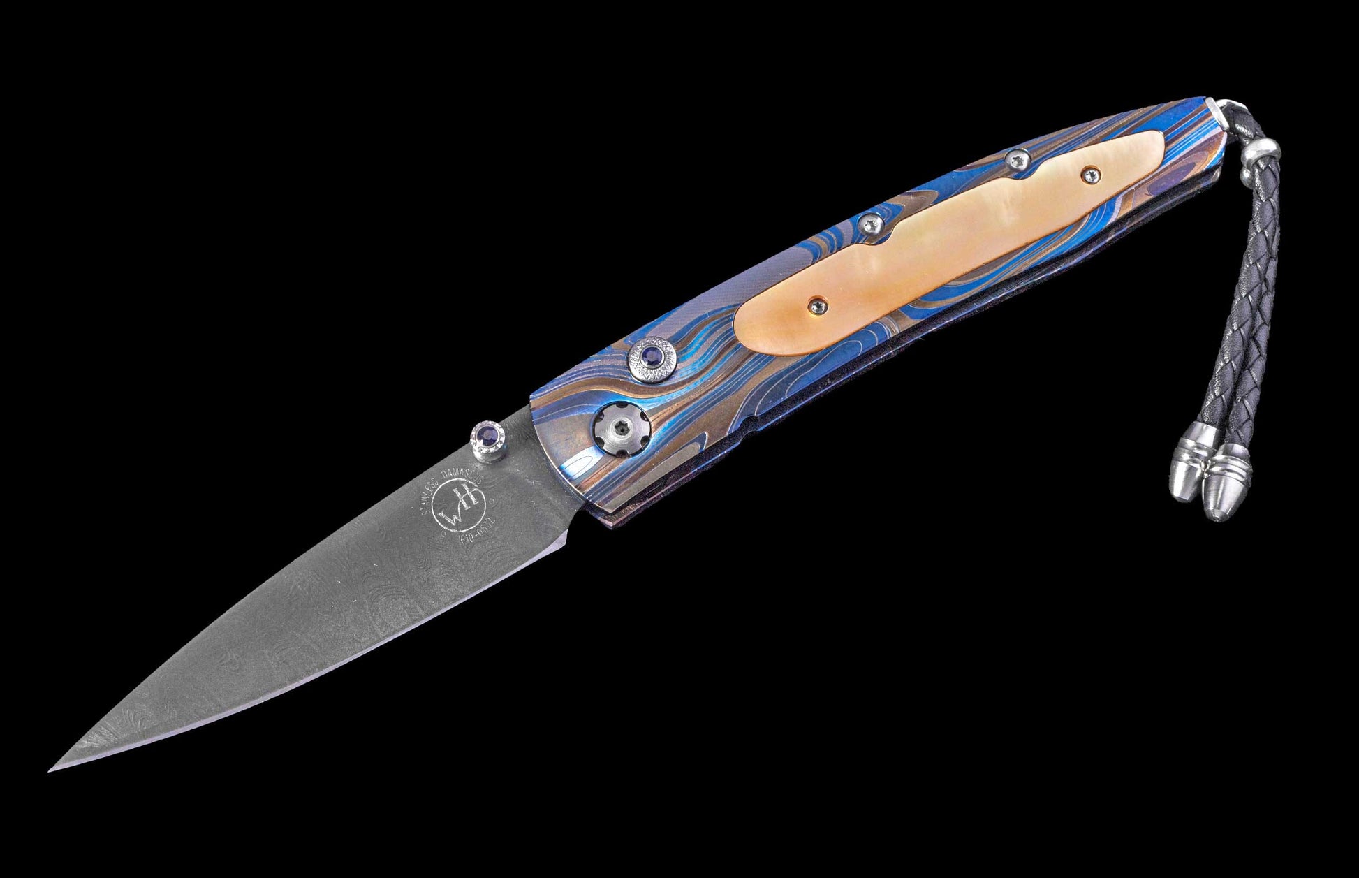 Folding knife with a blue and brown patterned handle, Damascus steel blade, mother-of-pearl inlay, blue jeweled accents, and a braided leather lanyard.