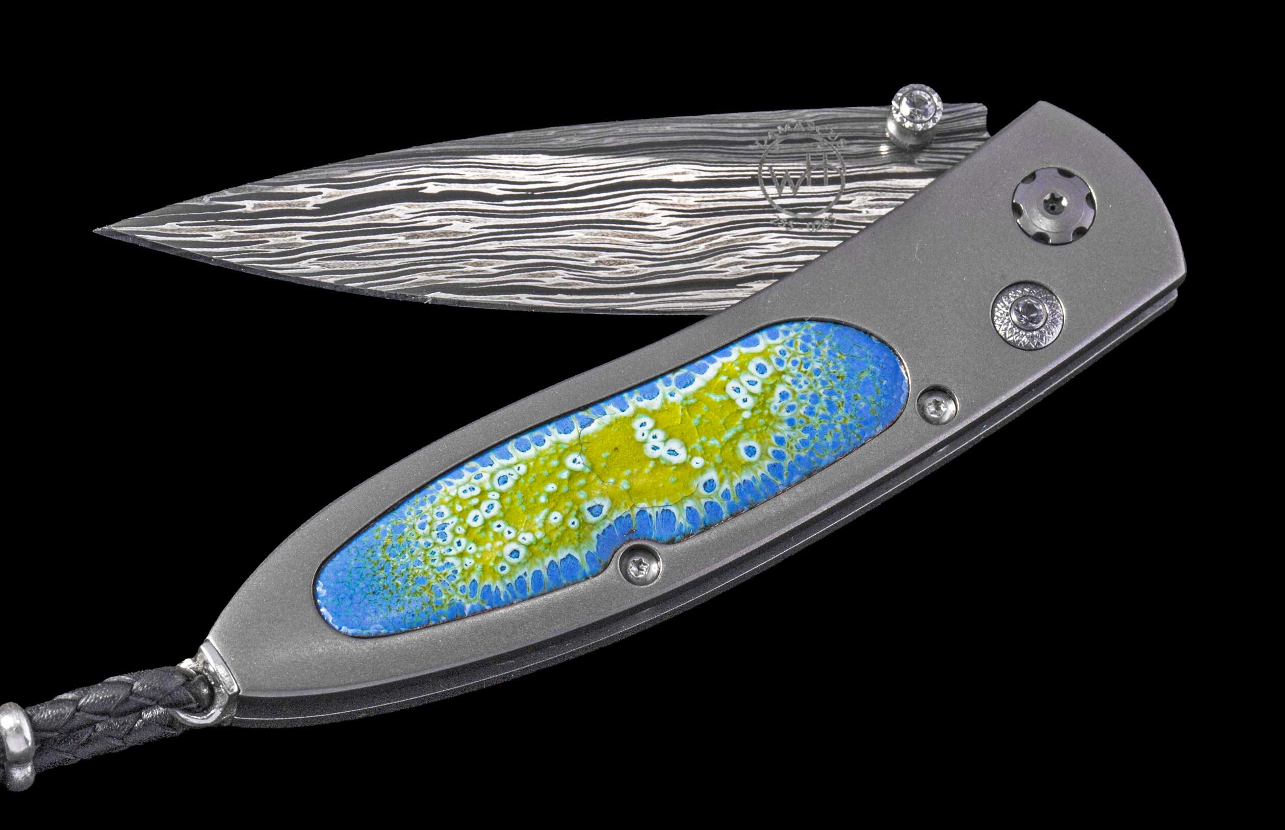 One of a Kind William Henry Custom Knife with titanium frame, enamel scales, white topaz gemstones, and damascus steel blade.