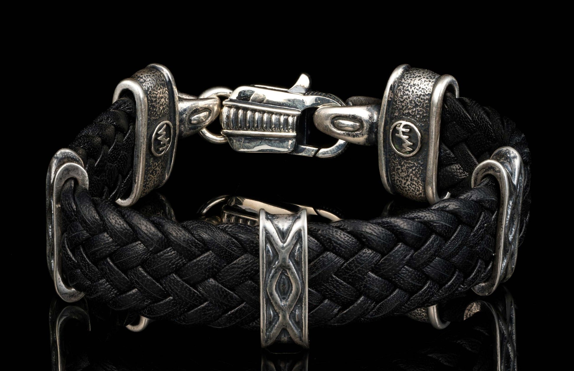 The black ‘Tilt’ leather bracelet from William Henry features widely woven kangaroo leather adorned with textured and patinated sterling silver details.